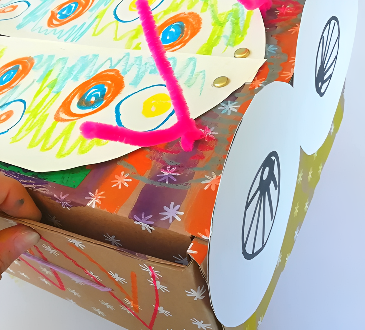 Handmade owl craft on decorated cardboard box