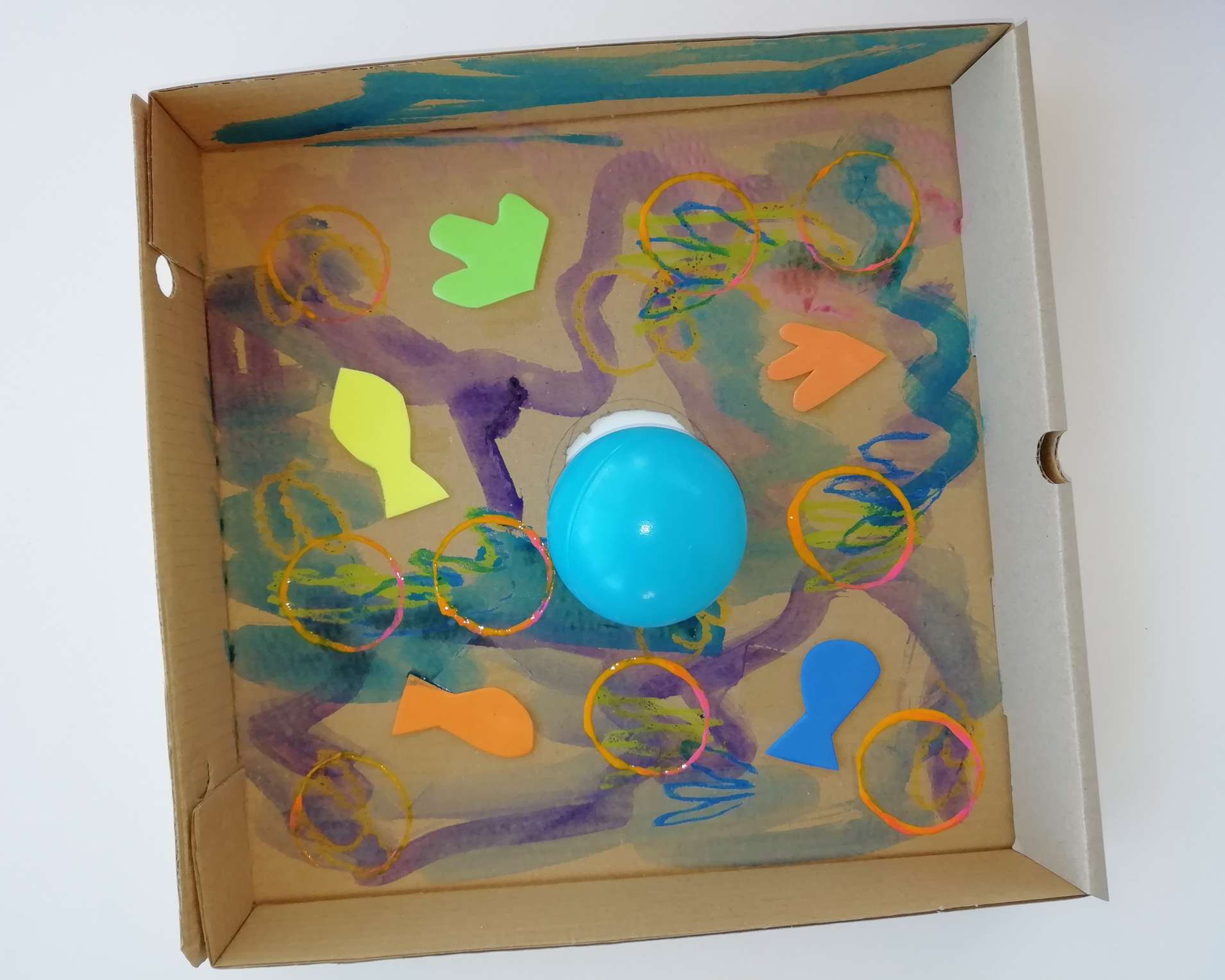 Cardboard fishing game with colorful paper fish